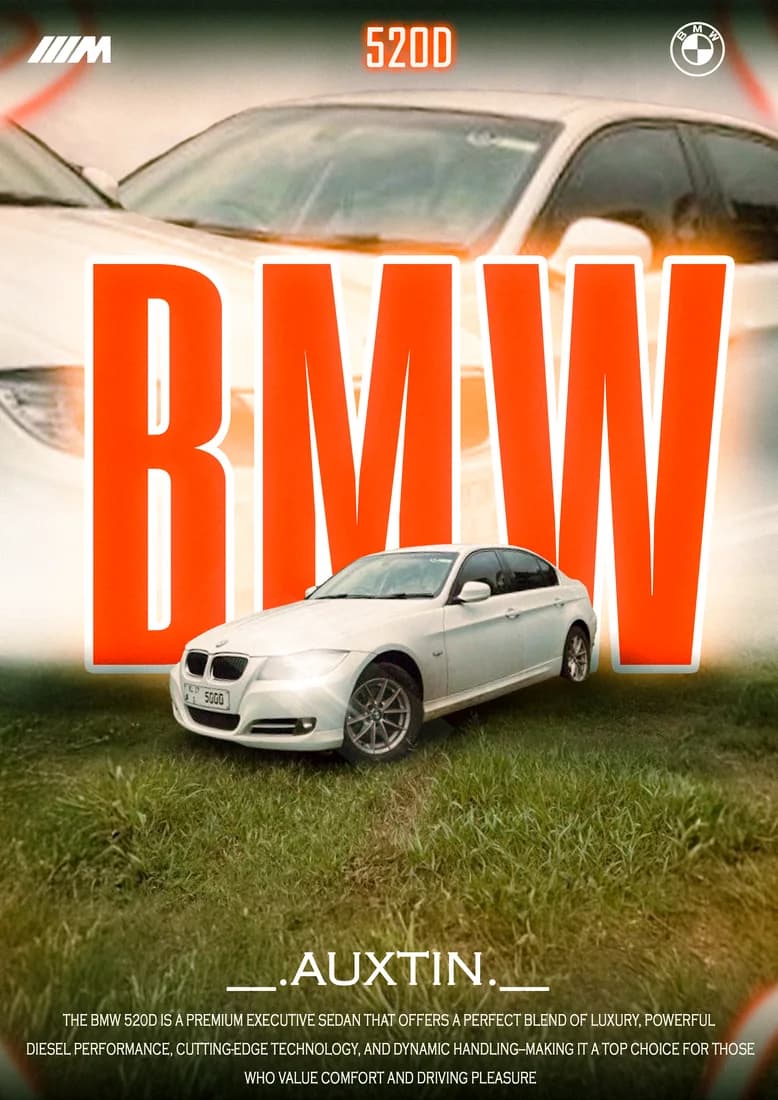 White BMW on grass with tall orange BMW lettering and 520D label.