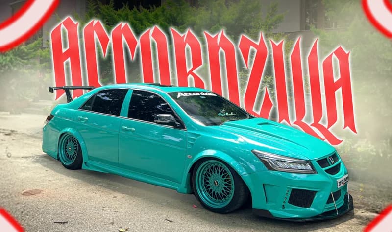 Landscape Accordzilla poster with red corner accents and trees behind the car.